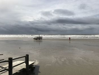 Pier over sea against sky