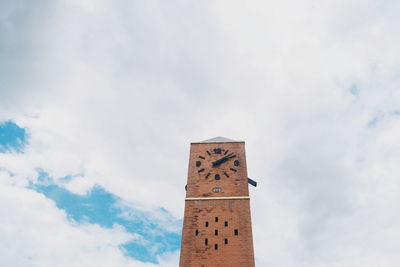 Low angle view of text on building against sky