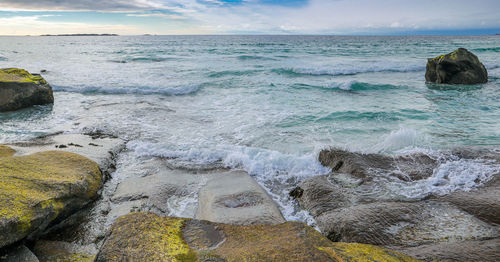 Scenic view of sea shore against sky