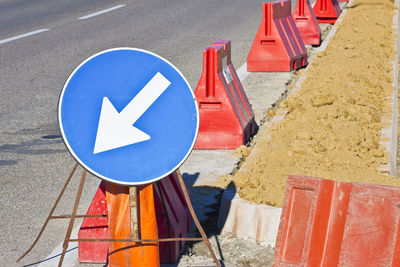 High angle view of arrow sign on road