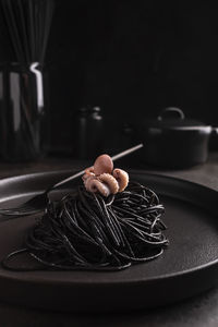 Black spaghetti with cuttlefish ink with octopus