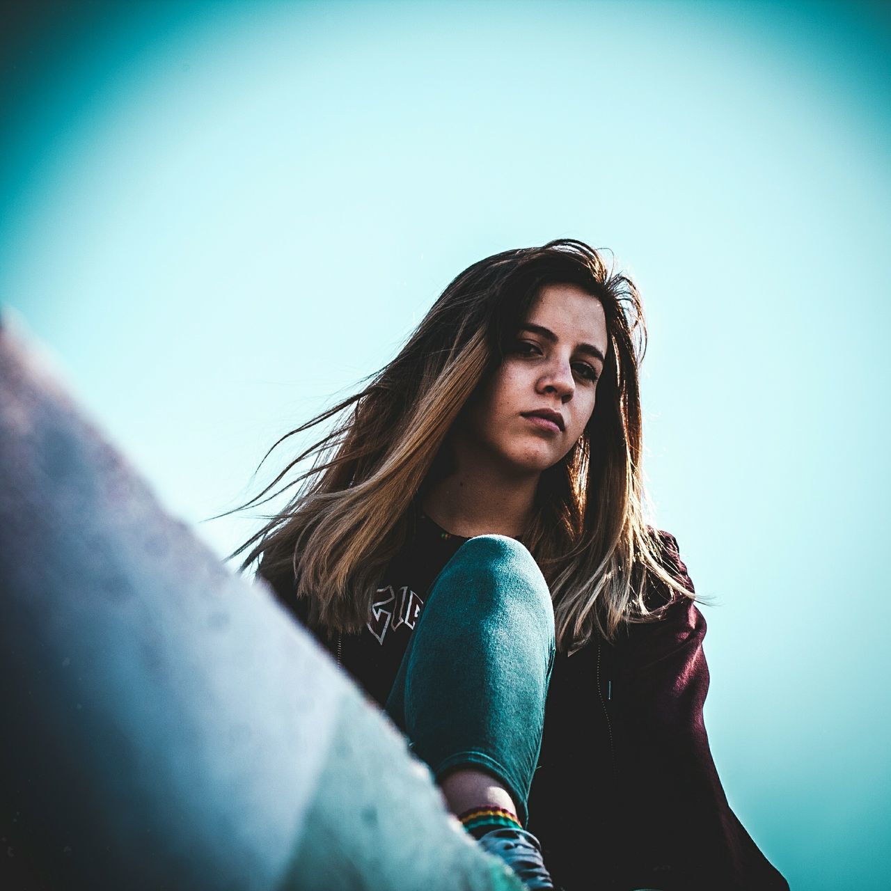 one person, lifestyles, long hair, young adult, real people, young women, hairstyle, hair, front view, leisure activity, casual clothing, portrait, women, day, clear sky, beauty, looking, low angle view, beautiful woman, contemplation