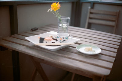 View of sushi on table with flower