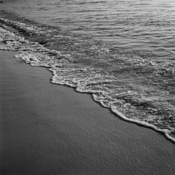 High angle view of surf on beach