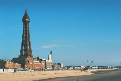 Blackpool tower at beach against sky