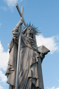 Low angle view of statue against sky