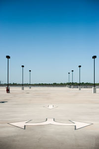 Airplane on street against clear sky