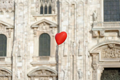 Red heart shape on building