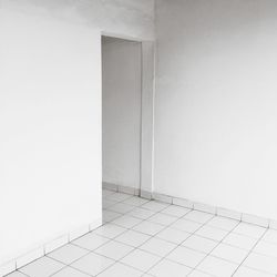 White wall with tiled floor