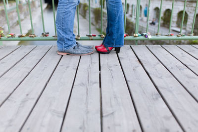 Low section of people standing on boardwalk