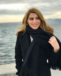 Portrait of a smiling young woman on beach