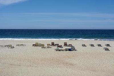 Scenic view of beach against blue sky