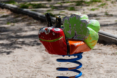 Close-up of red toy on sand