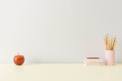 Close-up of fruits on table against white background