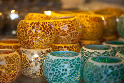Close-up of multi colored pottery for sale in market
