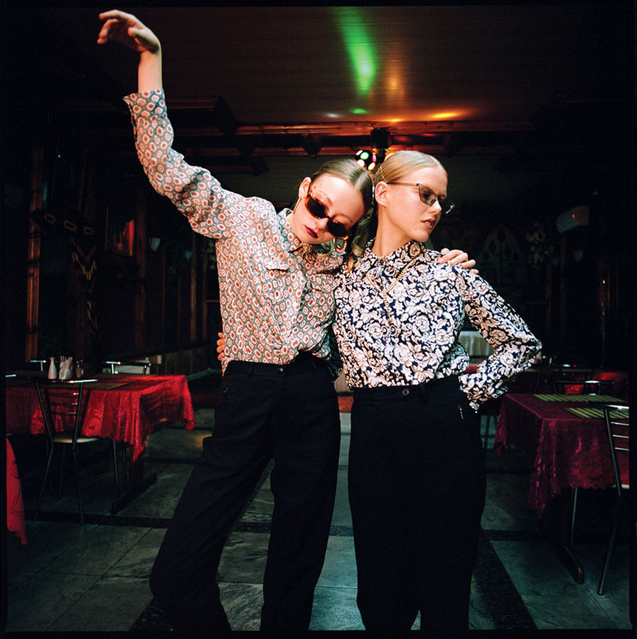 YOUNG COUPLE STANDING IN TRADITIONAL CLOTHING