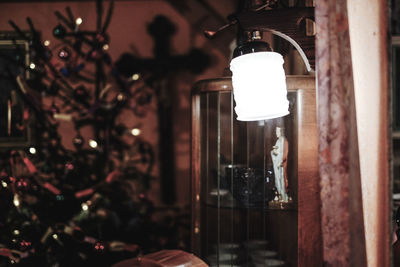 Close-up of illuminated light bulb at home