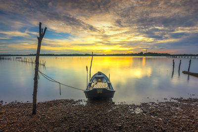 Scenic view of lake against sky during sunset