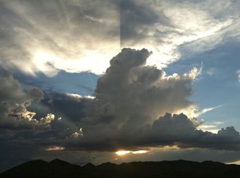 Low angle view of silhouette mountain against sky