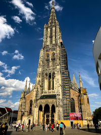 Low angle view of cathedral against cloudy sky