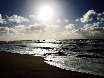 Scenic view of beach against sky during sunset