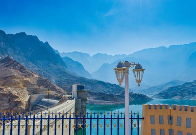 Buildings against mountain range