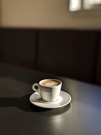 Close-up of cappuccino on table