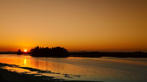 View of calm sea at sunset