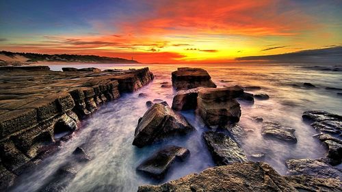 Scenic view of sea against sky during sunset