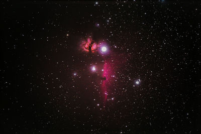 Low angle view of stars against sky at night