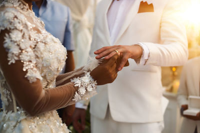 Close-up of couple holding hands