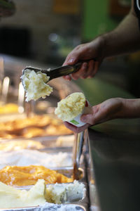 Close-up of hand holding ice cream