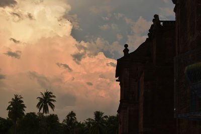 Low angle view of silhouette statue against sky