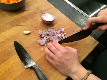 Cropped image of hand holding dough