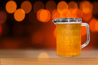 Close-up of beer glass on table