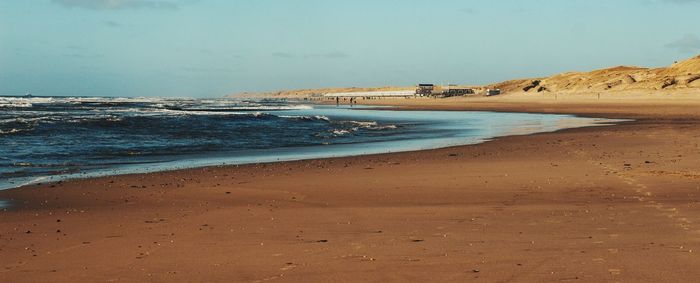 Scenic view of beach against sky