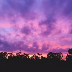 Silhouette of landscape against cloudy sky