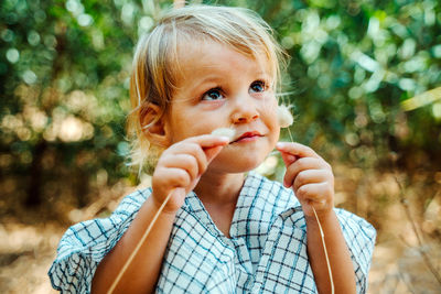 Close-up portrait of boy eating food