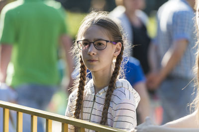 Portrait of girl against blurred background