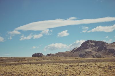 Scenic view of arid landscape against sky