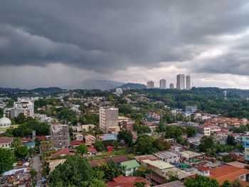 High angle view of buildings in city against sky