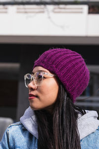 Portrait of young woman wearing hat