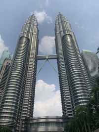 Low angle view of buildings in city against sky