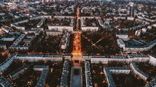 High angle view of city lit up at night