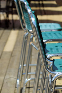 Close-up of empty chairs arranging outdoors