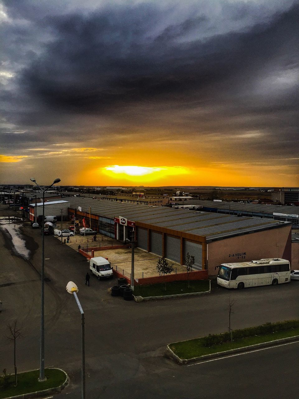 sunset, sky, cloud - sky, high angle view, architecture, city, building exterior, outdoors, nautical vessel, water, dramatic sky, no people, sea, cityscape, nature, beauty in nature, yacht, day