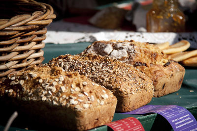 Various breads on table for sale during sunny day