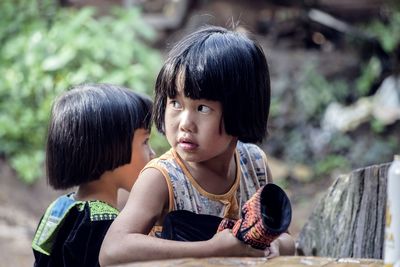 Portrait of young girl looking away