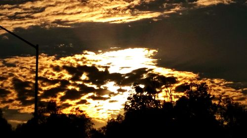 Low angle view of cloudy sky at sunset