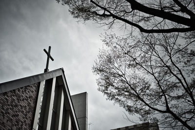 Low angle view of silhouette building against sky